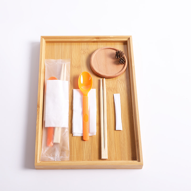 Wegwerpbamboe eetstokjes set met oranje lepel en papieren servet Frosted composiet filmset